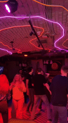 Nightlife scene unfolds at Saratov bar with dancing patrons