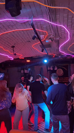 Nightlife scene unfolds at Saratov bar with dancing patrons