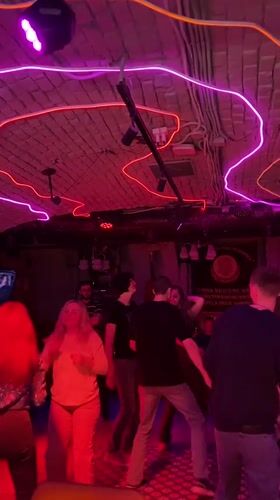 Nightlife scene unfolds at Saratov bar with dancing patrons