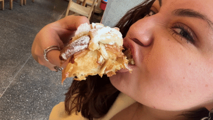 Customer enjoys pastries at Mexico City bakery Thursday evening