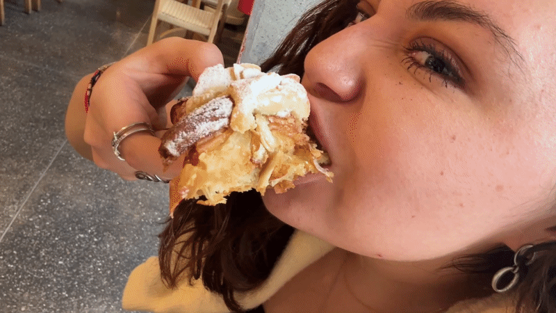 Customer enjoys pastries at Mexico City bakery Thursday evening