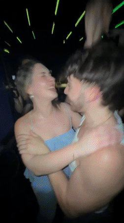 Young people dance at Sofia nightclub under colorful lights