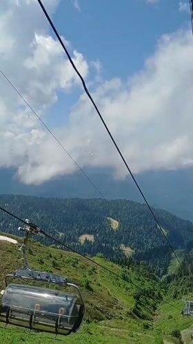 Gondola ride up a mountain resort near Estosadok, Russia