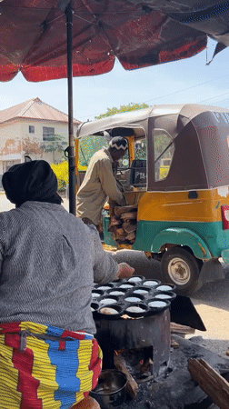 Morning street life unfolds in Jos, Nigeria marketplace