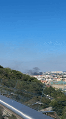 Heavy smoke plumes rise over Kyiv skyline, August 2026