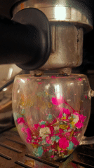 Coffee extracted into flower-filled mug in Bulgarian cafe