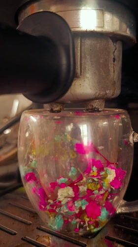 Coffee extracted into flower-filled mug in Bulgarian cafe