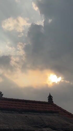 Cloudy morning light over a Balinese villa compound in Ubud