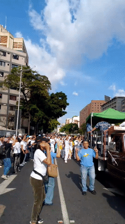 Street march with Venezuelan flags moves through Caracas