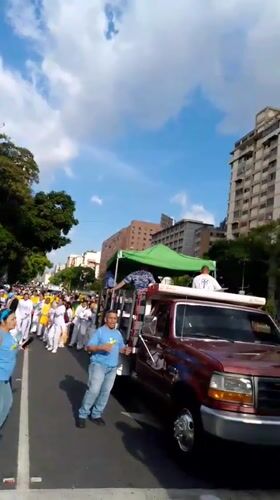 Street march with Venezuelan flags moves through Caracas
