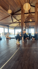 Woman practices tennis ball exercises in Mengwi wooden room