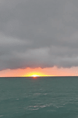 Sunset documented over Black Sea beach in Kobuleti, Georgia