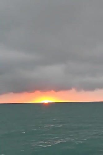 Sunset documented over Black Sea beach in Kobuleti, Georgia