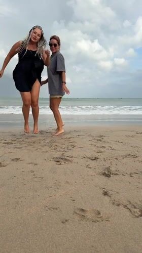 Candid moments on Kuta Beach under cloudy skies
