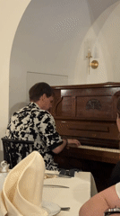 Restaurant pianist performs during dinner service in Minsk