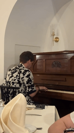 Restaurant pianist performs during dinner service in Minsk