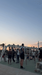 Evening beach workout and leisure activities at Barcelona's Barceloneta Beach