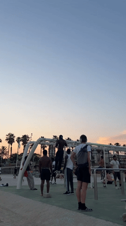 Evening beach workout and leisure activities at Barcelona's Barceloneta Beach