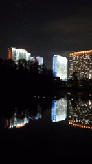 Moscow skyline creates striking nighttime reflections in water