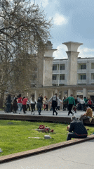 Folk dancers gather in circle at Varna public square