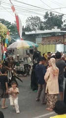 Traditional street performances and costumed parade in Sabrang, Indonesia