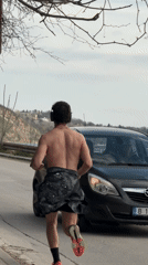 Morning jogger runs along coastal road in Varna