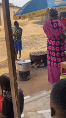Street food preparation captured at Jos market stall