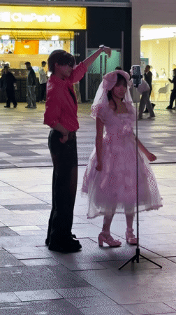 Girl in pink dress, man spotted in Chengdu square