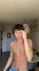 Individual documented in bathroom setting in Lourmarin, France