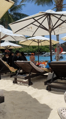 Beach resort with Amiana umbrellas and pool documented