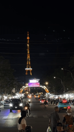 Evening street life bustles around Vinaphone tower in Da Lat