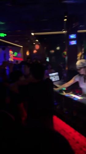Nightclub and bar scene in Liangjiang with DJ sets and pool