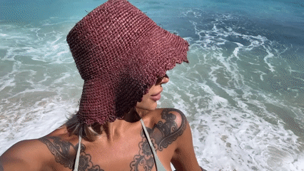 Woman photographed in various poses on Kuta Selatan beach