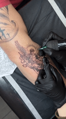 Tattoo session and selfies captured at studio during afternoon
