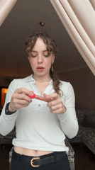 Woman applies makeup, takes selfies in Moscow apartment