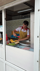 Street market morning in Kant, food stalls and shops open