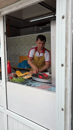 Street market morning in Kant, food stalls and shops open