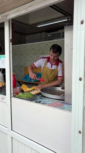 Street market morning in Kant, food stalls and shops open