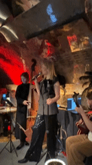 Woman performs with small band in Moscow