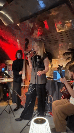 Woman performs with small band in Moscow