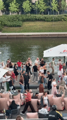 Outdoor dancing on a waterfront bar deck in Vilnius