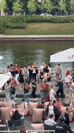 Outdoor dancing on a waterfront bar deck in Vilnius