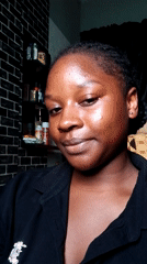 Young woman recorded making gestures, smiling at camera indoors