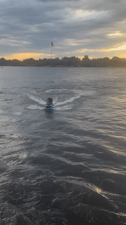 Jet skis on the Volga River, Astrakhan, summer evening.