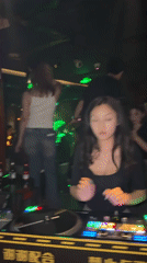 Female DJ performs at crowded Liangjiang nightclub