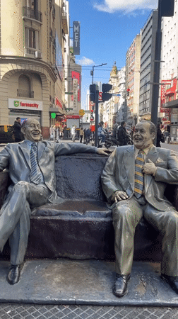 Laughing men sculpture spotted on Buenos Aires street corner