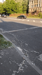 Sunny Moscow intersection captured on video during spring afternoon