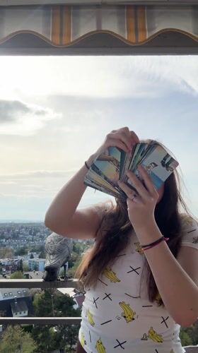 Woman reads tarot cards on balcony in Waiblingen