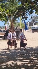 Traditional Balinese ceremony unfolds on a Denpasar beach