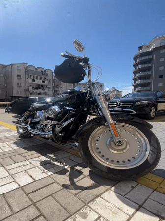 Motorcycle parked as customer visits cafe in Montenegro village